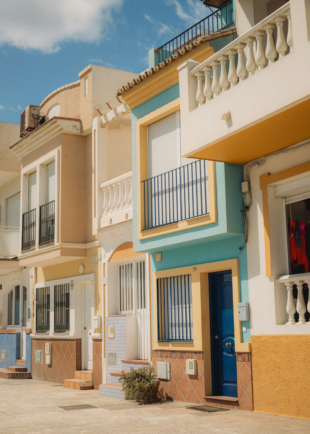 colorful-houses-with-balconies-under-a-blue-sky-i42kcstoht4